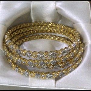 Set of four bangles with stones